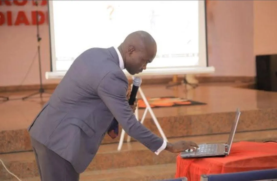 A presenter running a live demonstration on a laptop